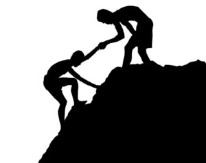 Bergsklättring. En man hjälper en annan. Illustrationen är i svart och vitt. Foto: Tumisu från Pixabay